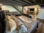 Lower-level Bunk House Bear Den with King bed, Bunk beds and sitting area with TV